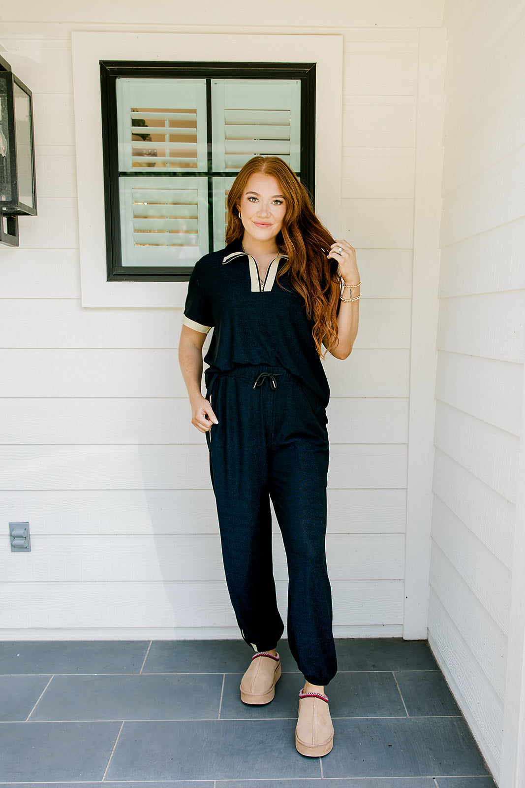 Woman with red hair wearing navy and gold shimmer pants. Model paired this top with Sparkle Top-Navy.