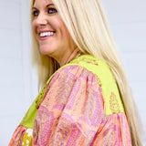 Woman with blonde hair showing side profile and sleeve detail of Jeanie Top. 