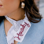 Lifestyle shot of white/maroon howdy frilly . The maroon howdy portion is embroidered.