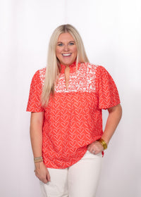 Front Honey Top red heart print top with embroidery.